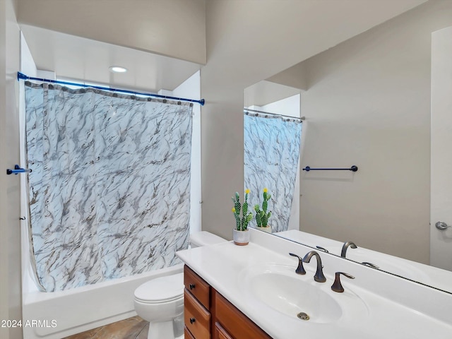 bathroom featuring tile patterned flooring, vanity, and toilet