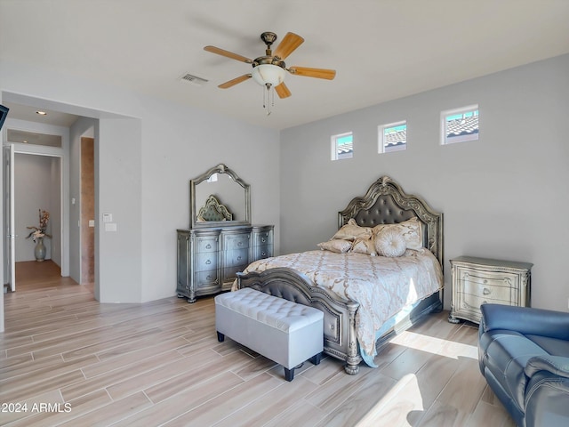 bedroom featuring ceiling fan and light hardwood / wood-style flooring