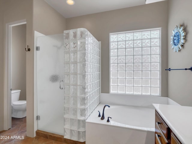 full bathroom with toilet, shower with separate bathtub, tile patterned floors, and vanity