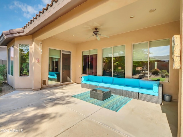 view of patio / terrace with an outdoor living space and ceiling fan