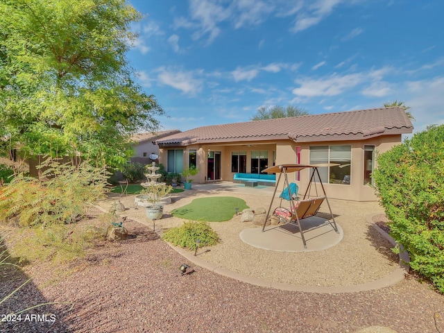 rear view of property with a patio