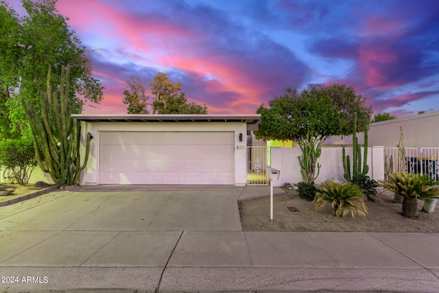 view of front of property with a garage