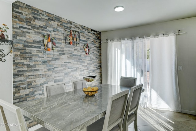 dining area with light tile patterned flooring