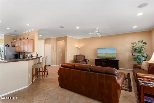 tiled living room with ceiling fan and crown molding