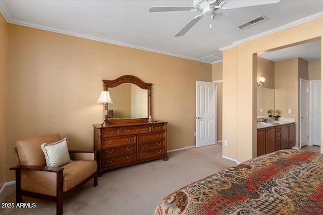 carpeted bedroom with ceiling fan, ornamental molding, and ensuite bath