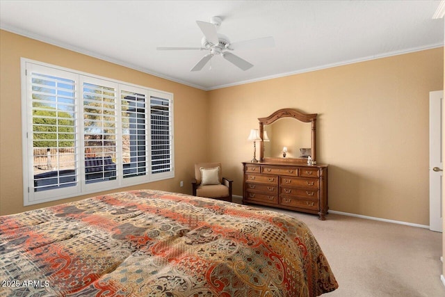 carpeted bedroom with ceiling fan and ornamental molding