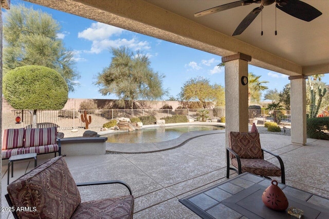 view of patio / terrace with an outdoor living space, a fenced in pool, and ceiling fan