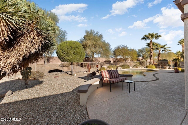 view of patio with a fenced in pool