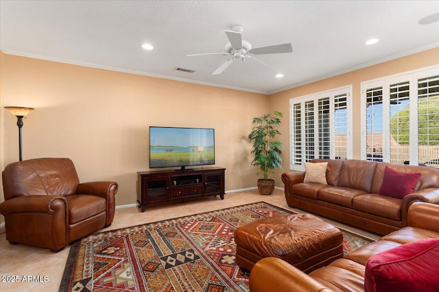 tiled living room with ceiling fan and crown molding