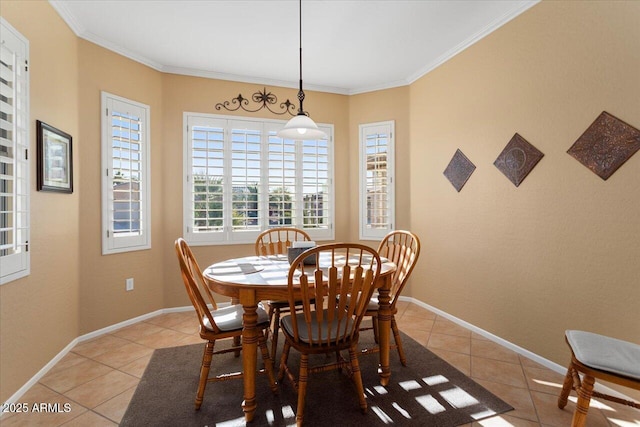 dining room featuring light tile patterned flooring and ornamental molding