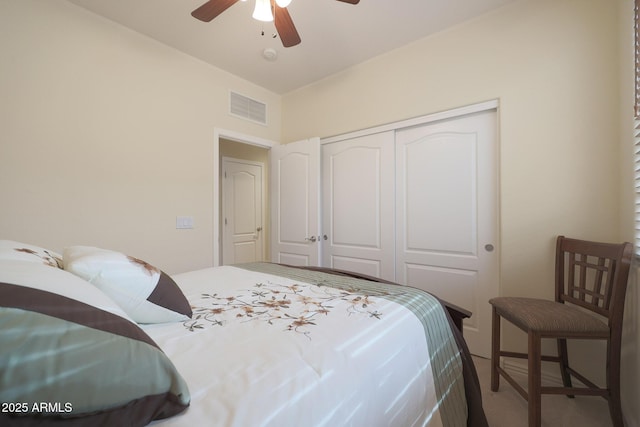 bedroom with ceiling fan and a closet