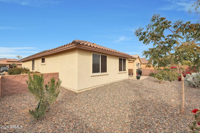 view of home's exterior featuring a patio