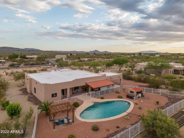 view of pool with a mountain view and a patio