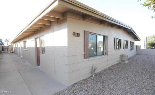 view of side of property featuring a patio area