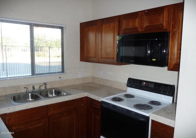 kitchen with sink and white electric range