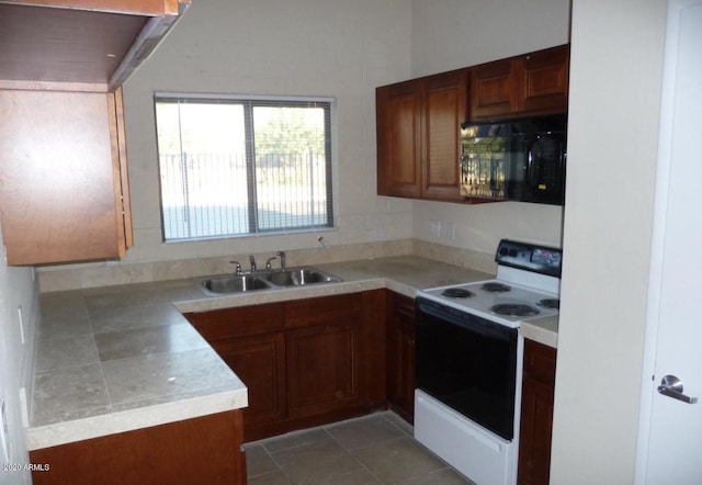 kitchen featuring white range with electric cooktop and sink