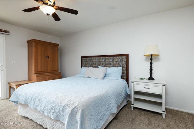 carpeted bedroom featuring ceiling fan and baseboards