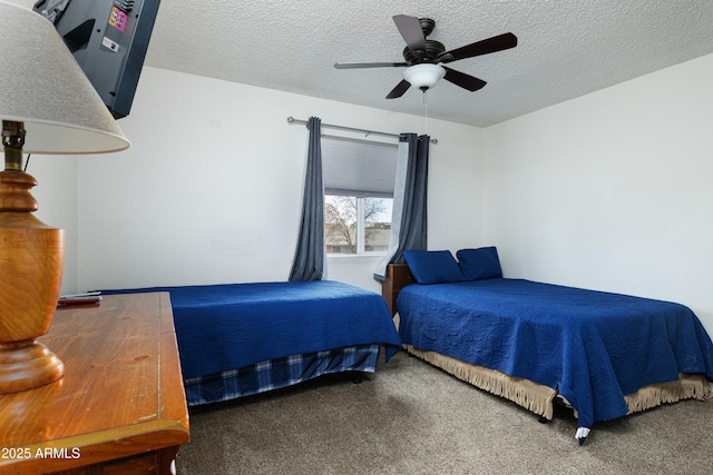 bedroom featuring a textured ceiling, ceiling fan, and carpet flooring