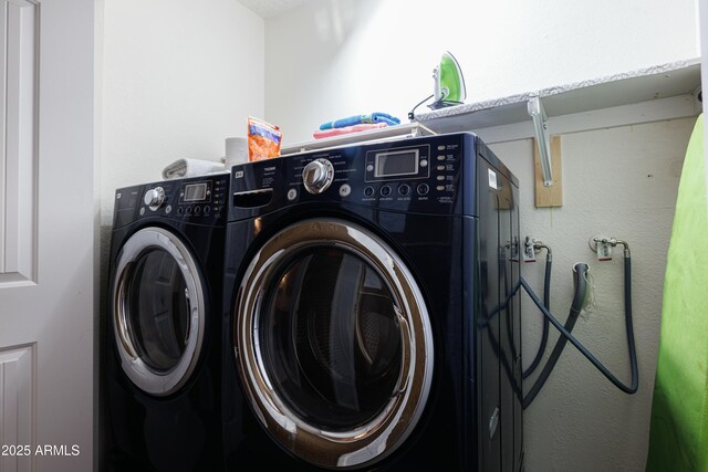 clothes washing area with laundry area and washing machine and dryer