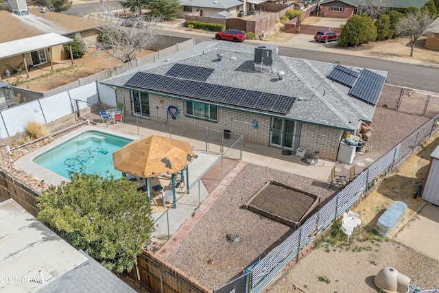 view of pool with a fenced backyard, a residential view, a fenced in pool, and a patio