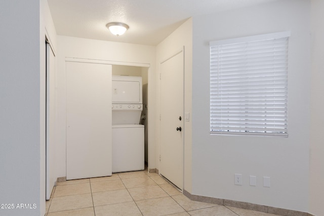 925 S Longmore Unit 201, Mesa, AZ 85202 - laundry room with stacked washer and clothes dryer and light tile patterned floors