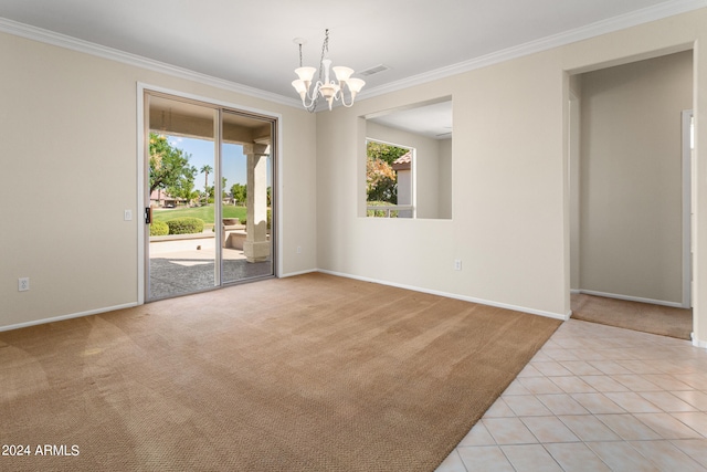 carpeted empty room featuring ornamental molding and a chandelier