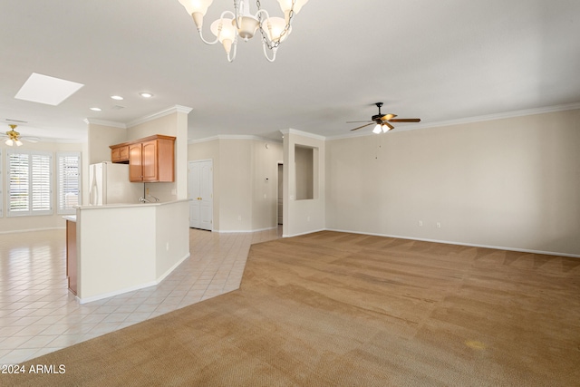 interior space with light carpet, ceiling fan with notable chandelier, and crown molding