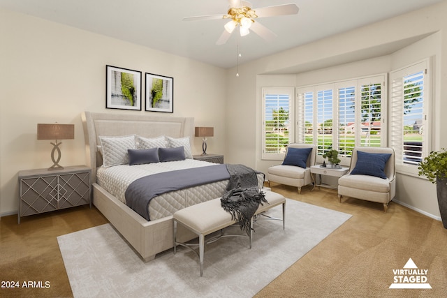 bedroom featuring ceiling fan and light colored carpet