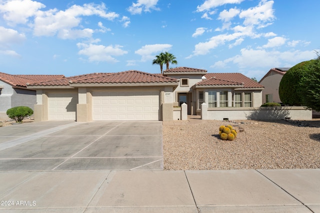 mediterranean / spanish house featuring a garage