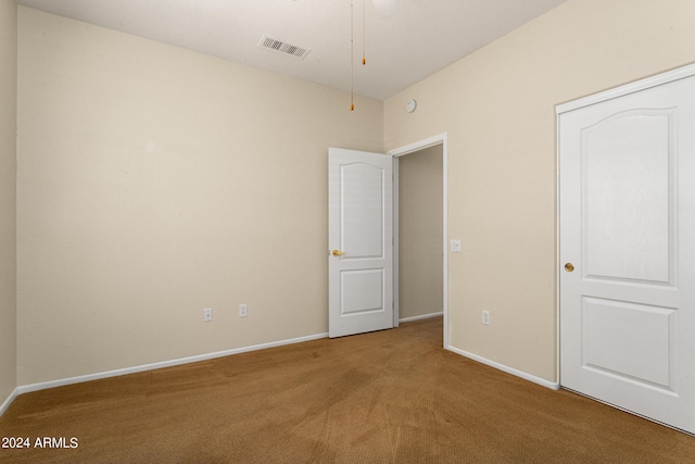 unfurnished bedroom with carpet flooring