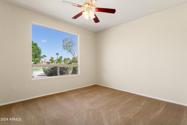 empty room with carpet floors and ceiling fan