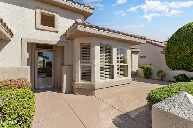 doorway to property featuring a patio area