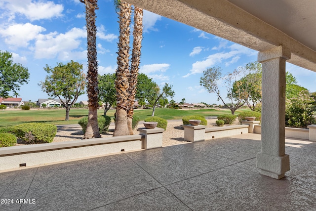 view of community featuring a lawn and a patio area