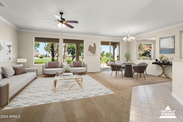 living room with light colored carpet, ceiling fan with notable chandelier, and crown molding