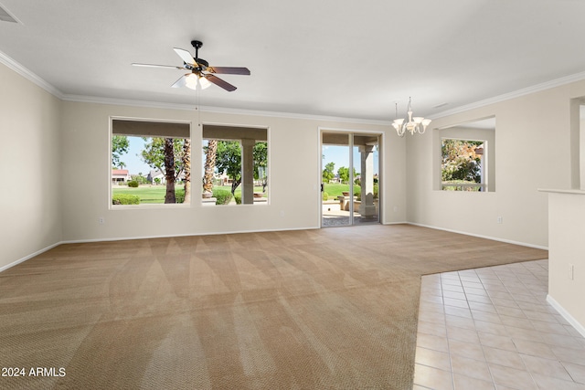 carpeted spare room with ceiling fan with notable chandelier and ornamental molding