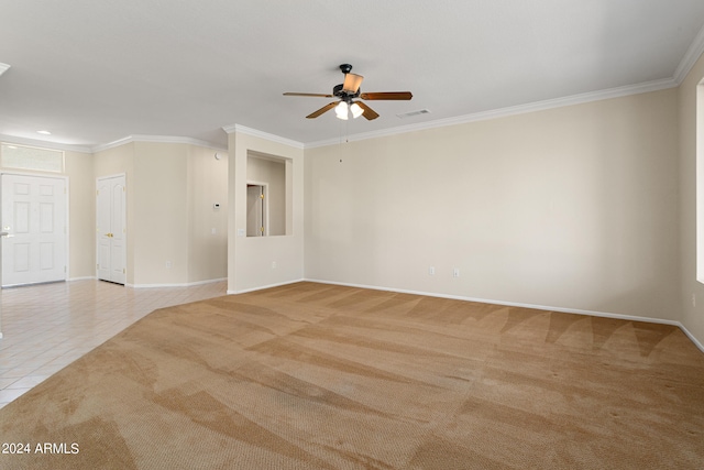 carpeted spare room featuring ornamental molding and ceiling fan