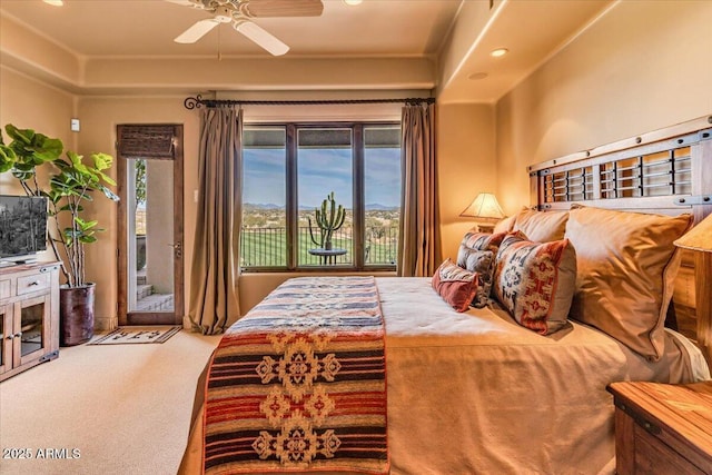 carpeted bedroom featuring access to exterior and ceiling fan