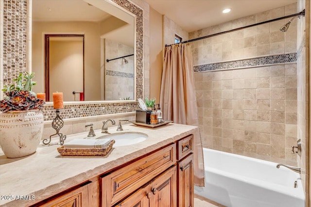 bathroom featuring vanity, shower / tub combo with curtain, and backsplash