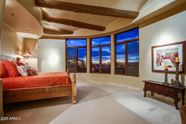 bedroom with lofted ceiling and carpet floors