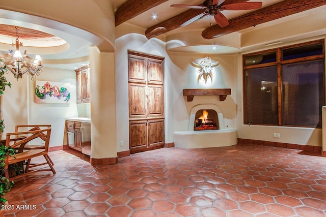 interior space with an inviting chandelier and beam ceiling