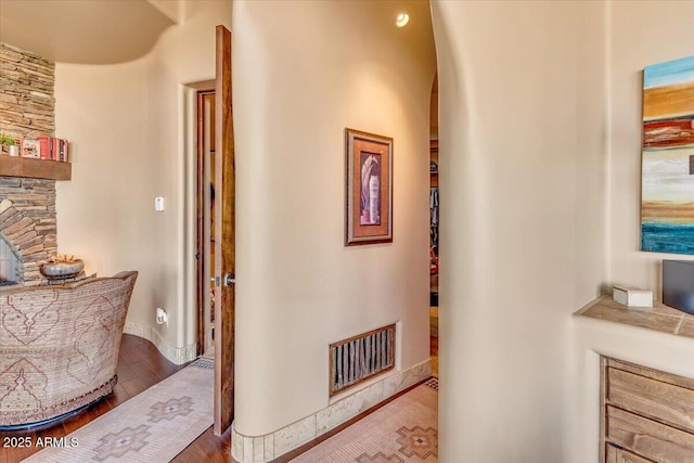 hallway with wood-type flooring