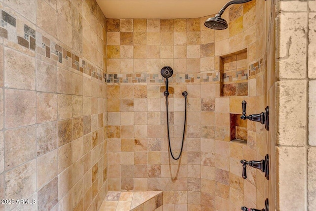 bathroom with tiled shower