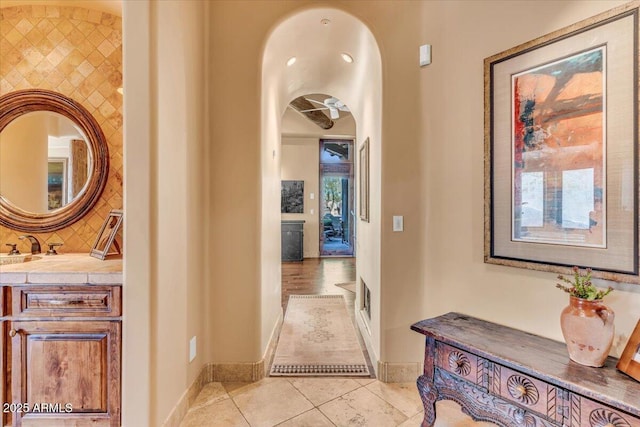 corridor with light tile patterned flooring