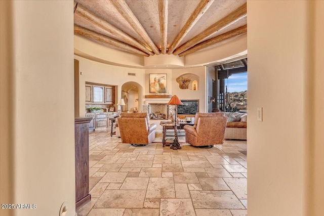 living room featuring beam ceiling