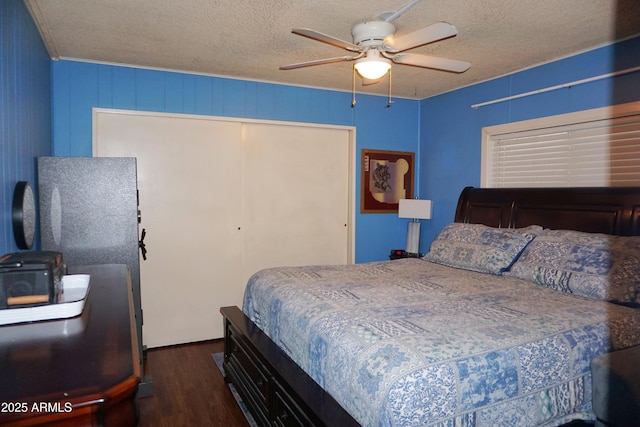 1034 S 3rd St, Coolidge, AZ 85128 - bedroom with wood finished floors, a closet, a textured ceiling, and a ceiling fan