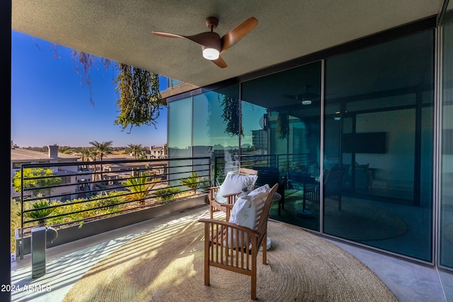 balcony featuring ceiling fan