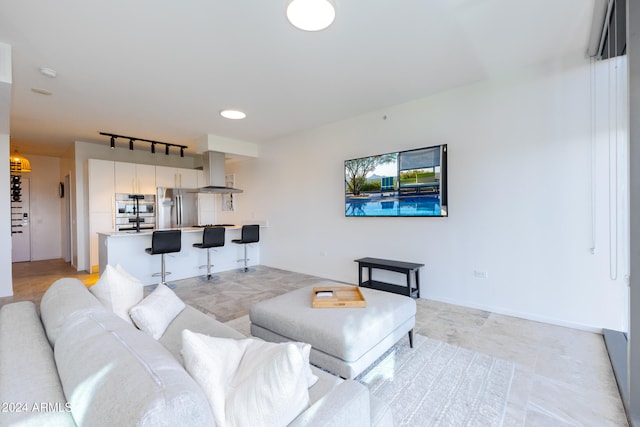 living room featuring track lighting