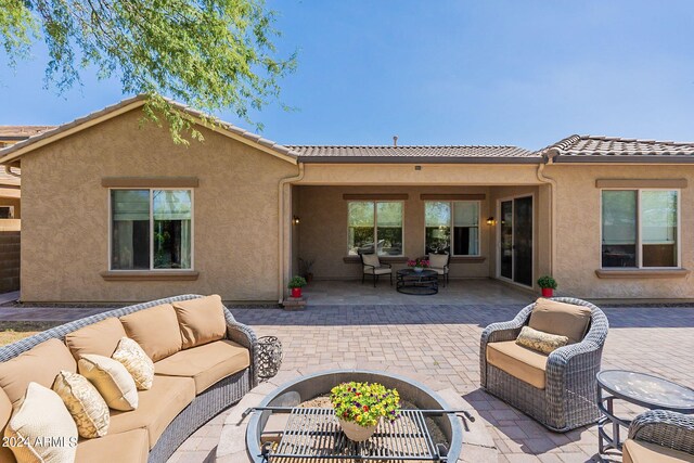 view of patio / terrace featuring an outdoor living space with a fire pit