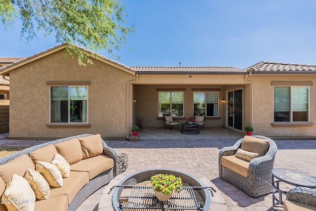 rear view of house with a patio and an outdoor hangout area