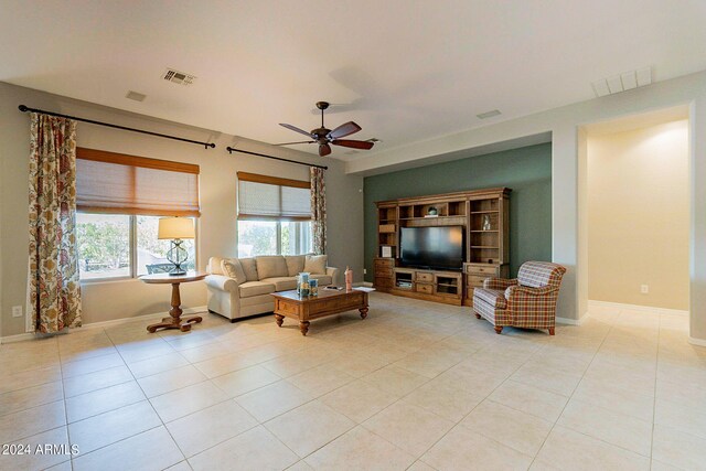 hallway featuring light tile patterned flooring, french doors, and a notable chandelier